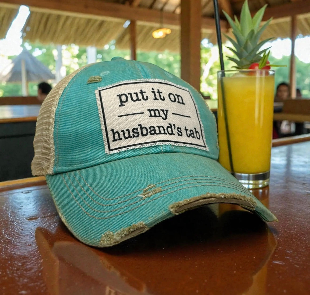 Put It on My Husband's Tab Trucker Hat