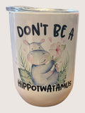 Tumbler with a hippo illustration and text on a white background