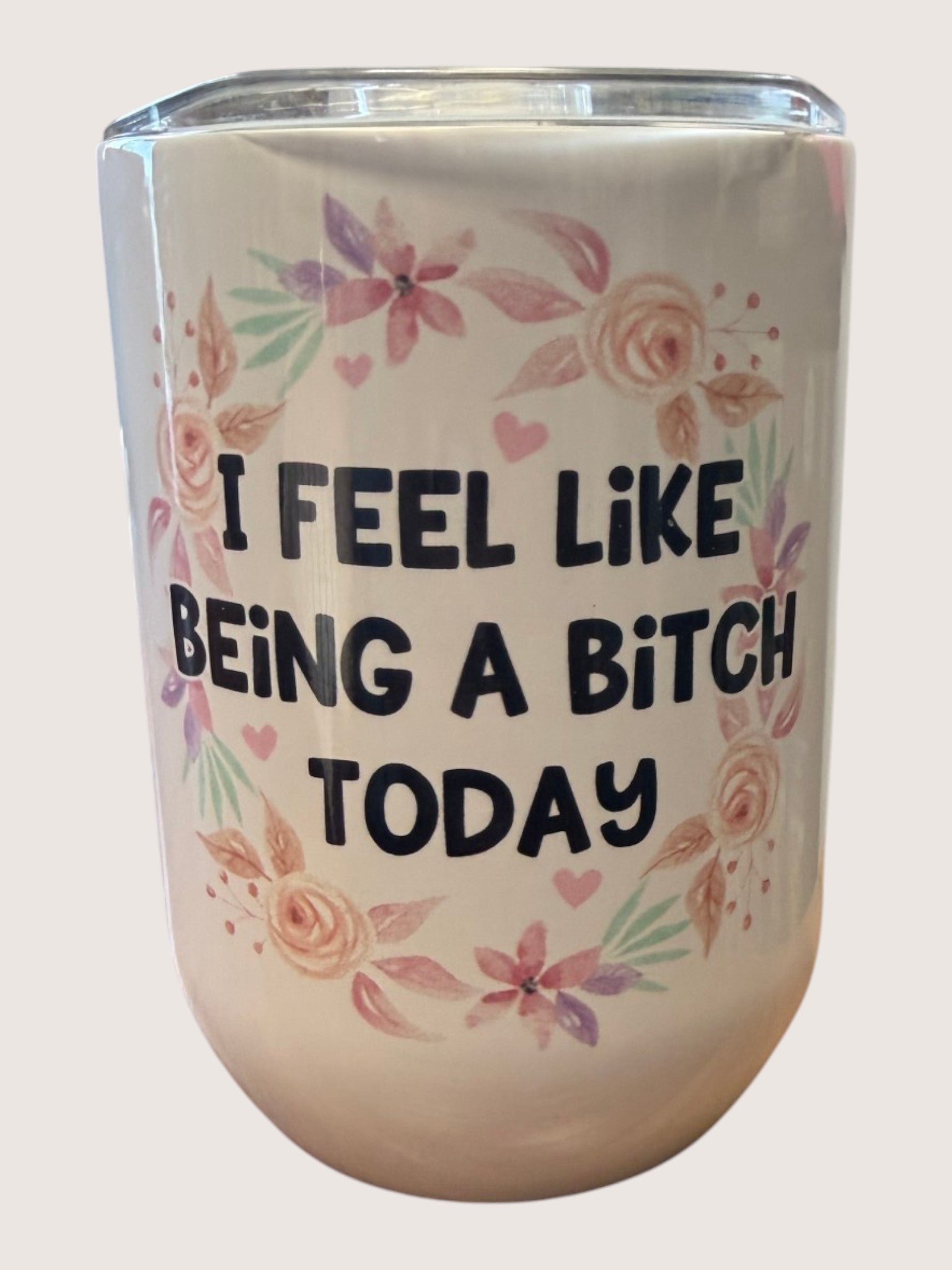 Tumbler with floral design and text 'I Feel Like Being A Bitch Today' on a white background