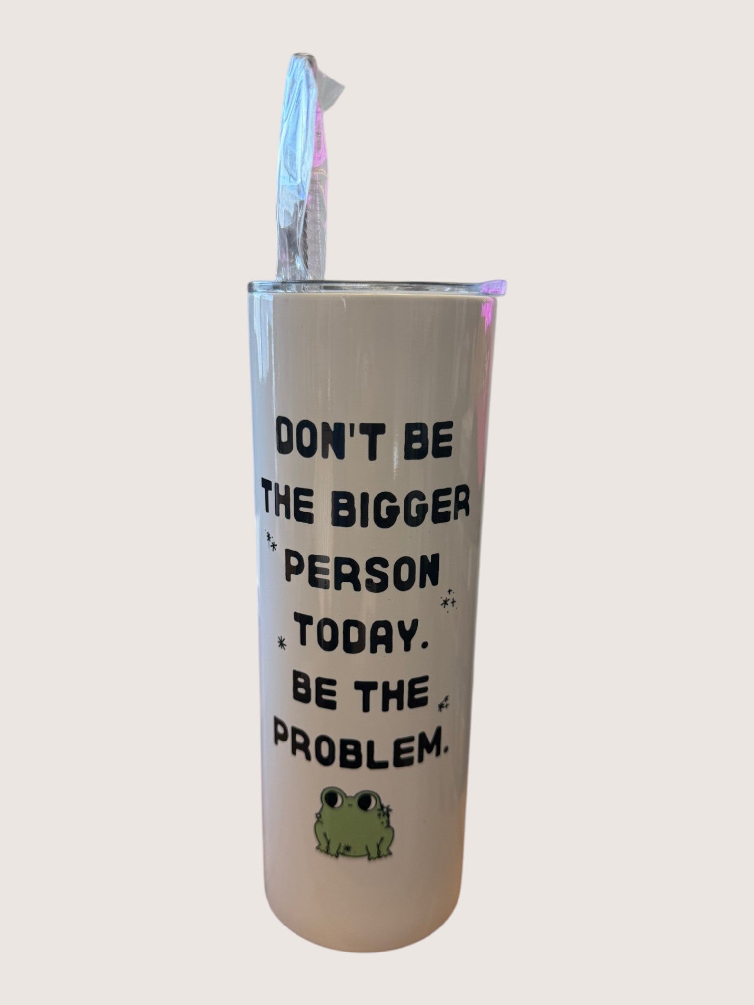 Tumbler with motivational quote and frog graphic on a white background