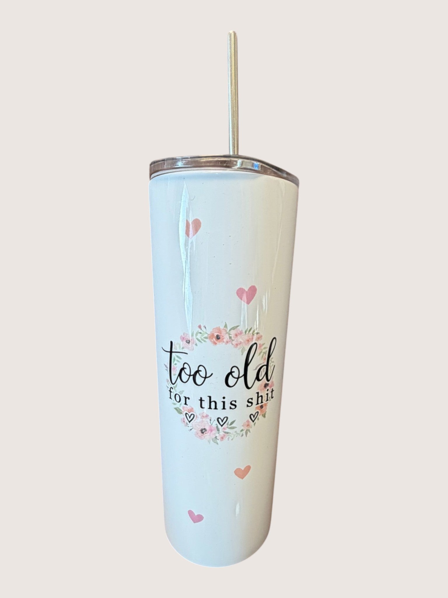 Light blue tumbler with floral designs and text on a white background