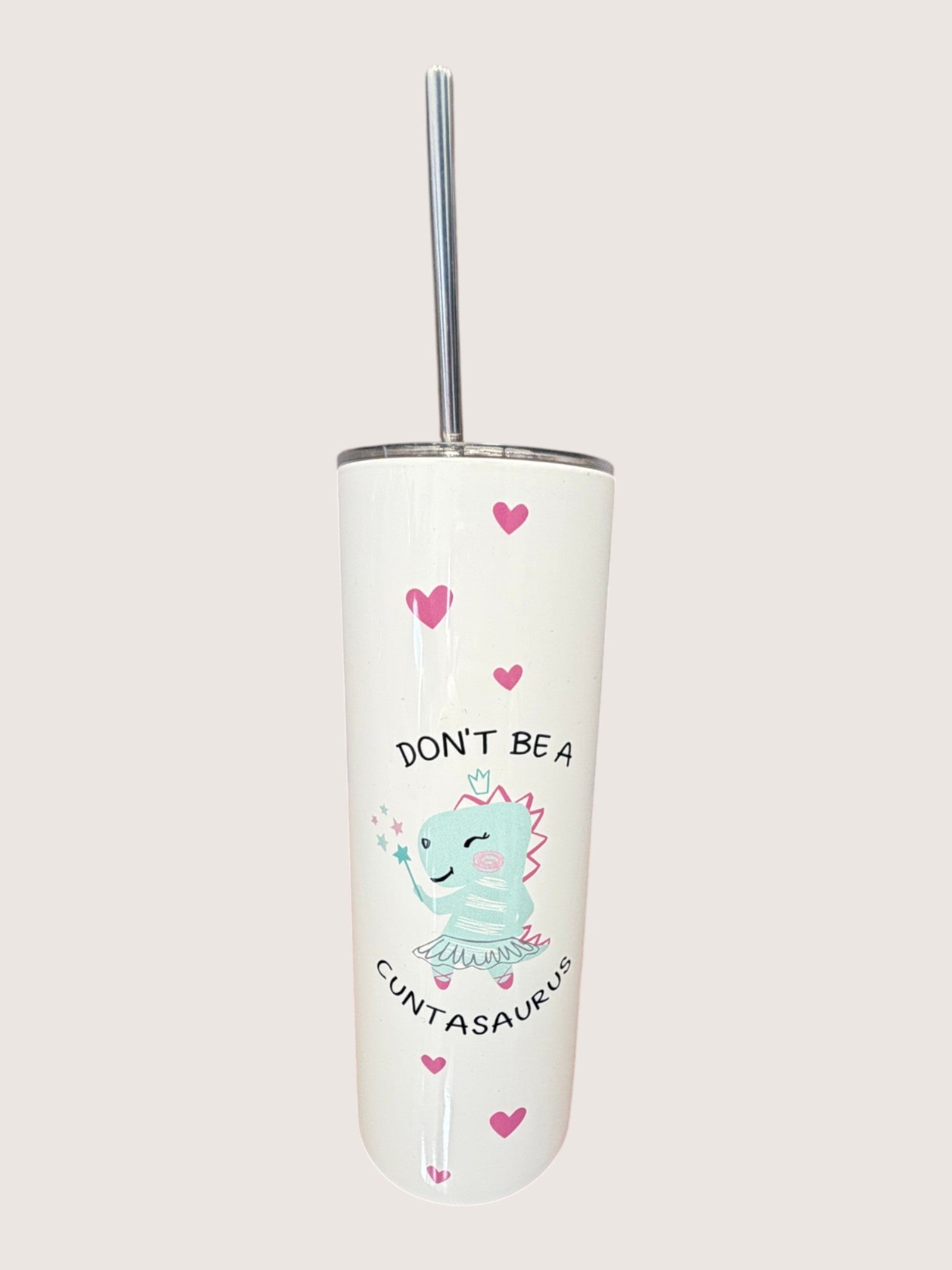 Tumbler with cartoon dinosaur design and text on a white background
