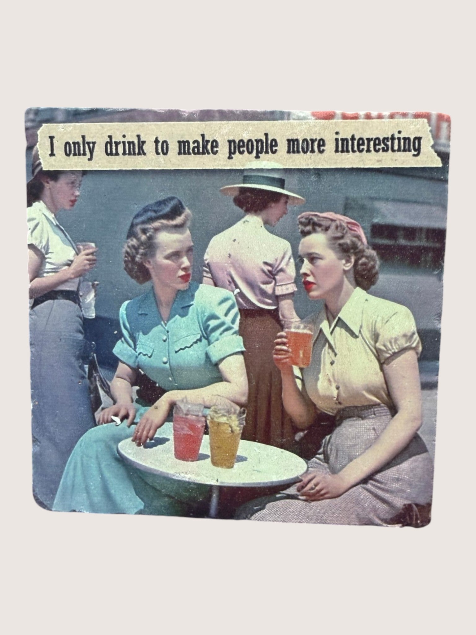 Vintage-style photo Coaster of women sitting at a table with drinks, with text overlay.
