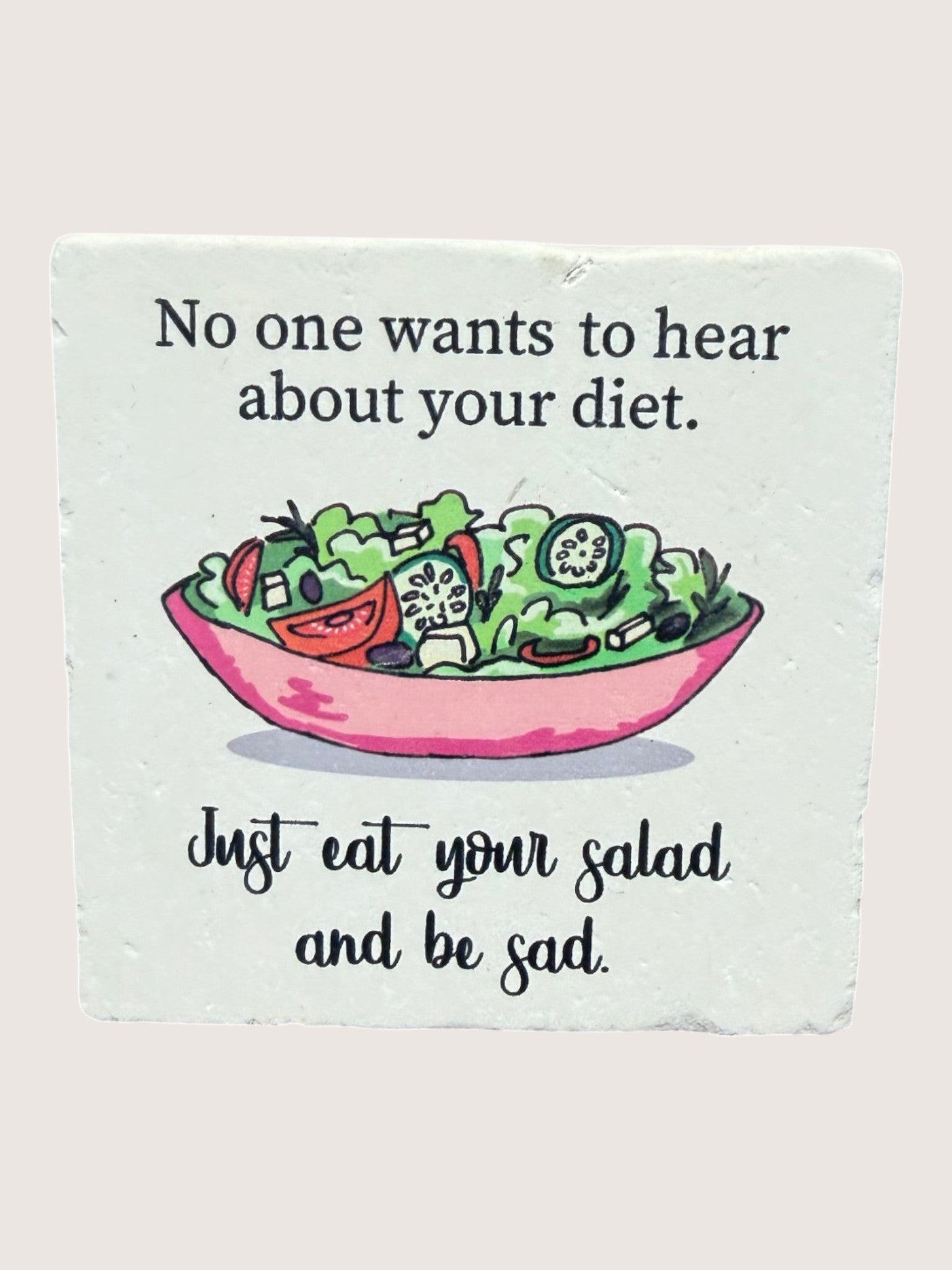 Coaster with Cartoon salad bowl with humorous text on a light background