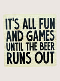 Wooden Coaster with black text 'It's all fun and games until the beer runs out' on a light background