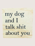Wooden coaster with text 'my dog and I talk shit about you' on a beige background