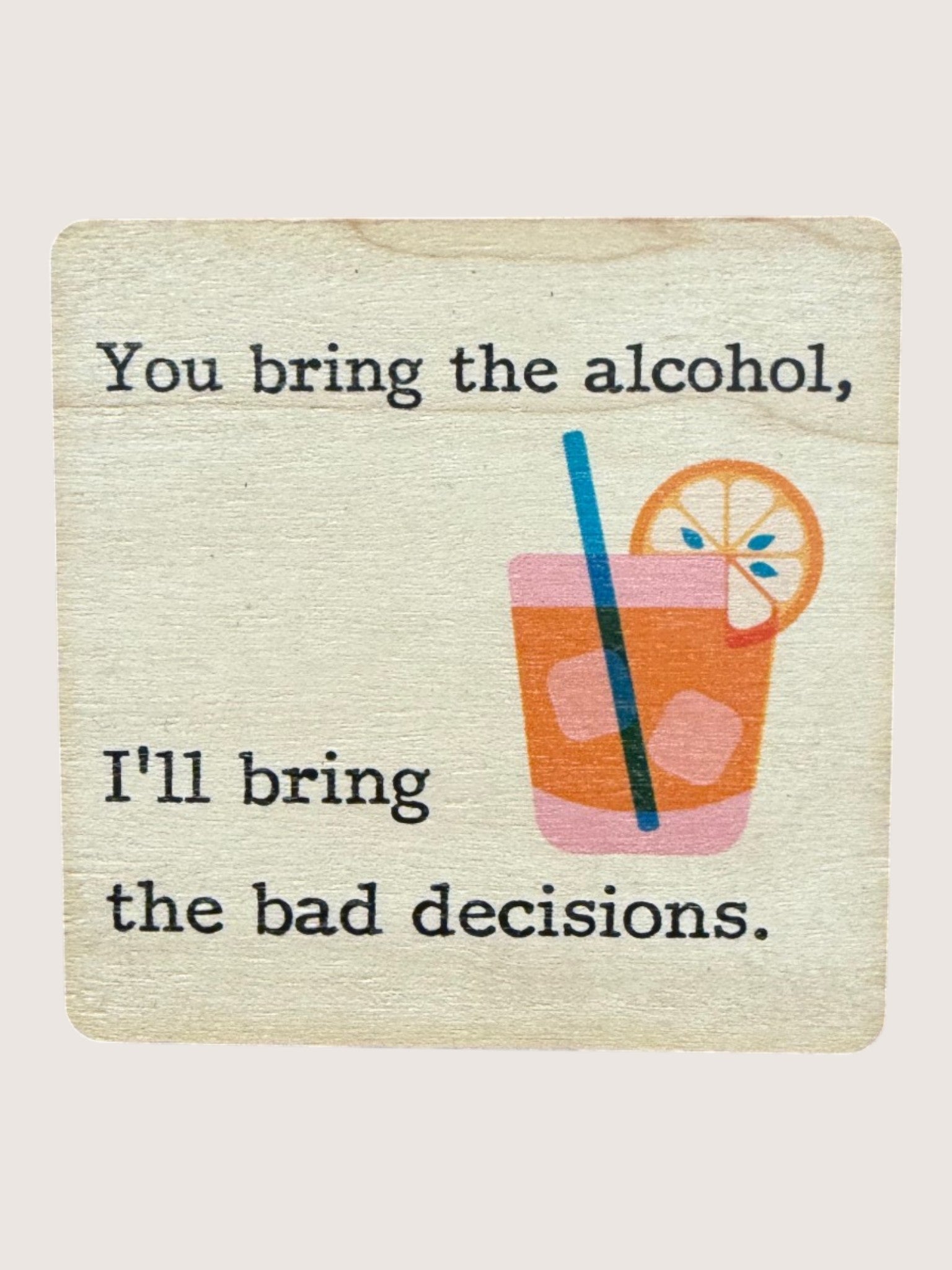 Coaster with a drink illustration and humorous text on a light background