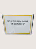 card with text 'This is your yearly reminder that you married up' on a white background
