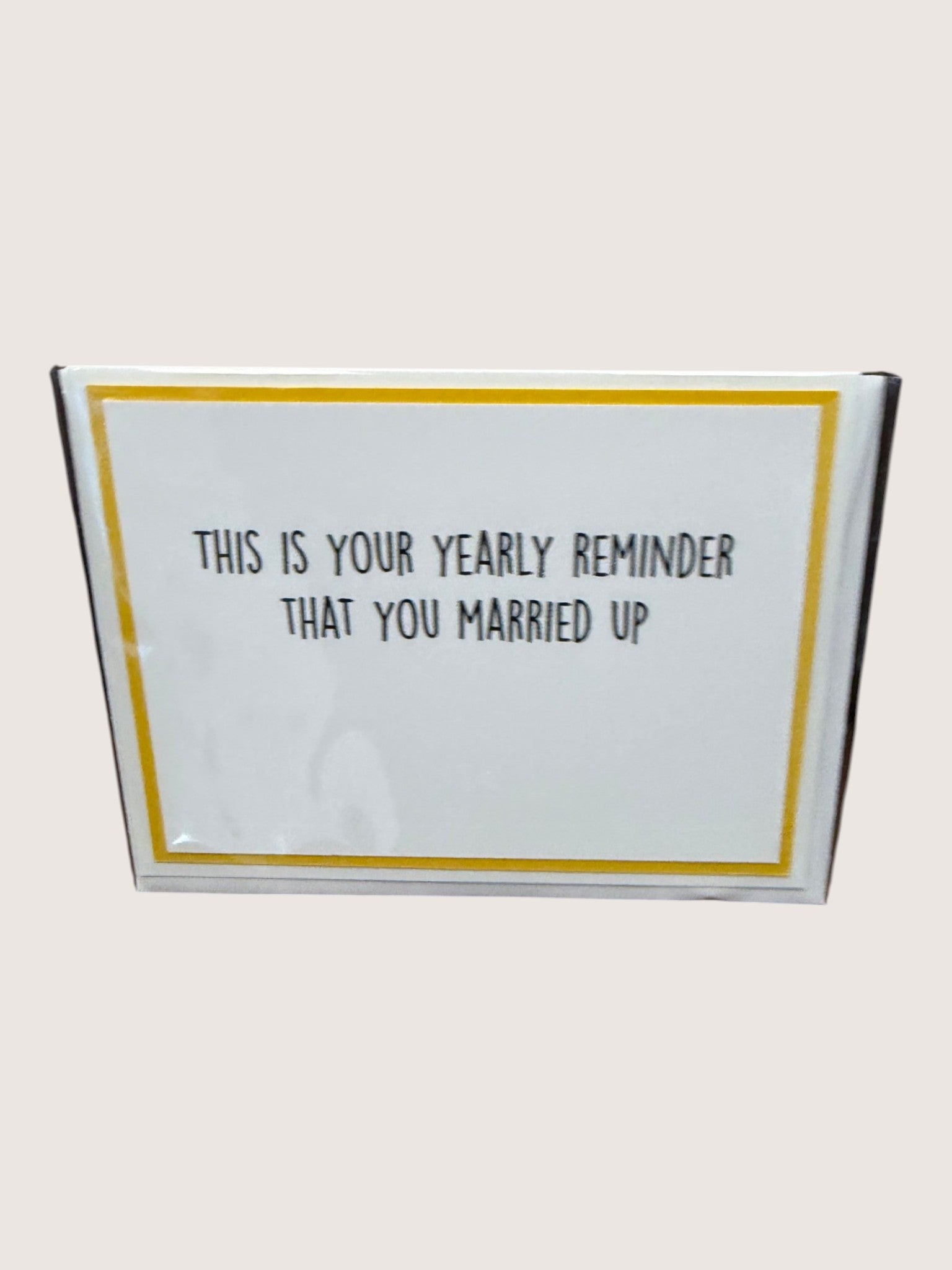 card with text 'This is your yearly reminder that you married up' on a white background