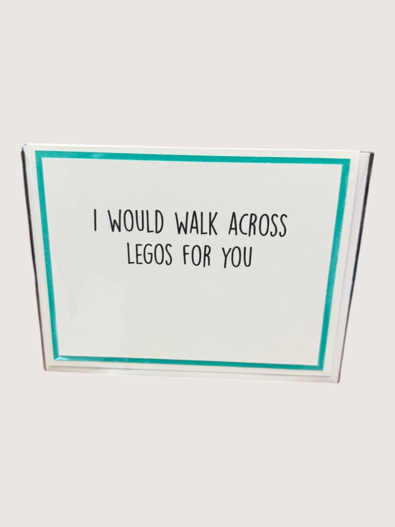 Card with text 'I would walk across Legos for you' on a white background