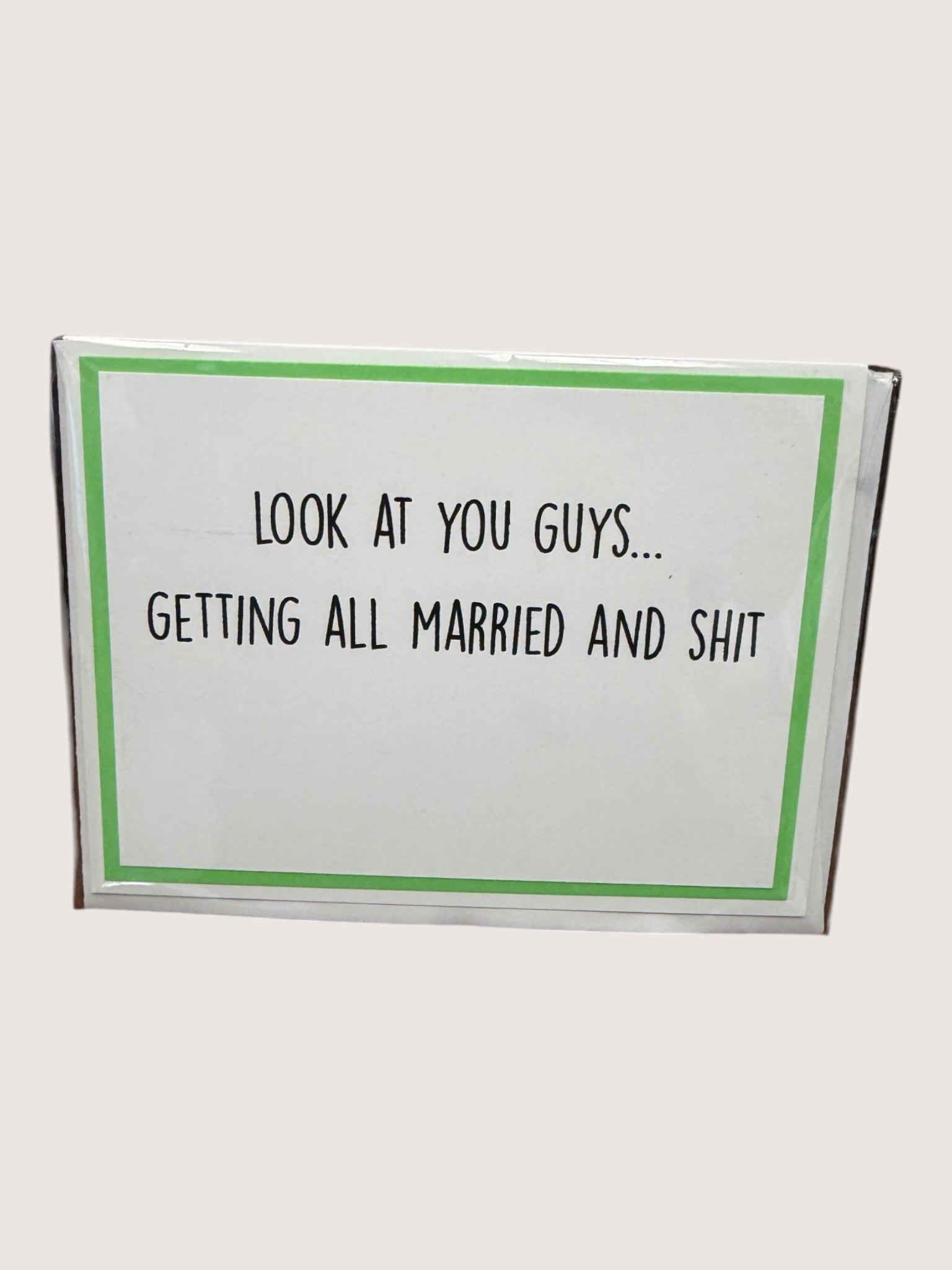 Card with text 'Look at you guys... getting all married and shit' on a white background
