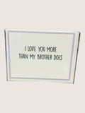 Card with text 'I love you more than my brother does' on a white background