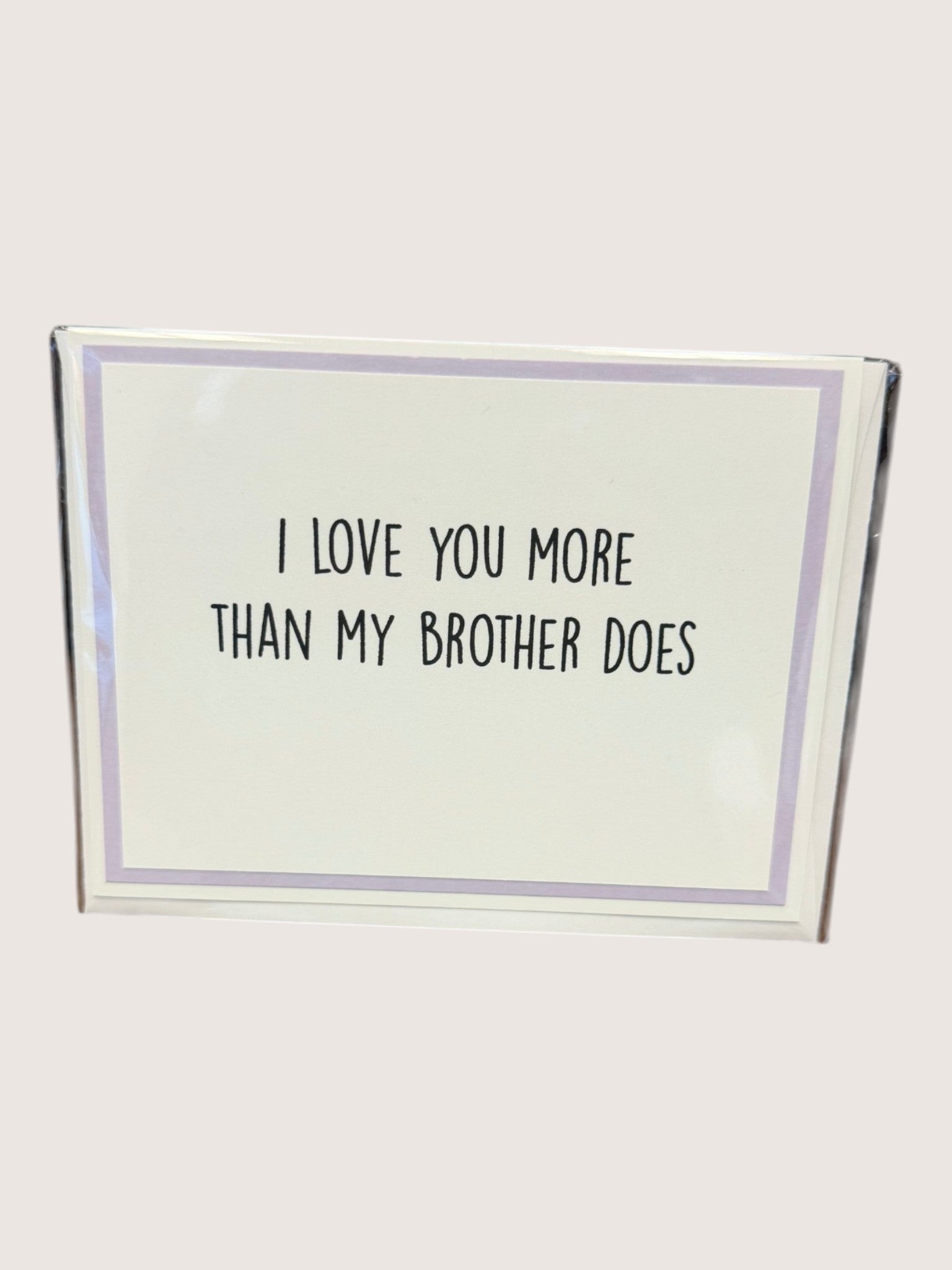 Card with text 'I love you more than my brother does' on a white background
