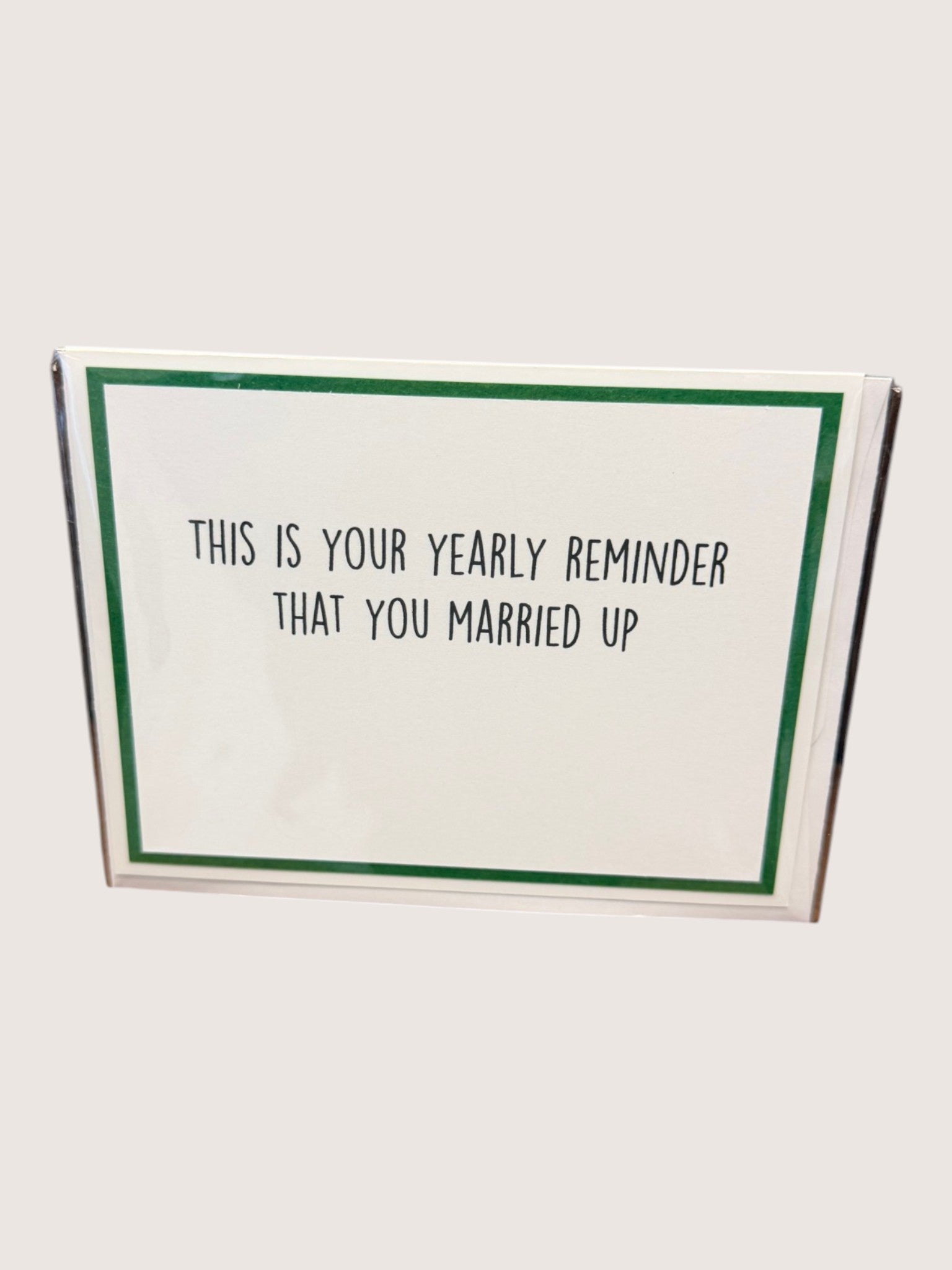 Card with text 'This is your yearly reminder that you married up' on a white background