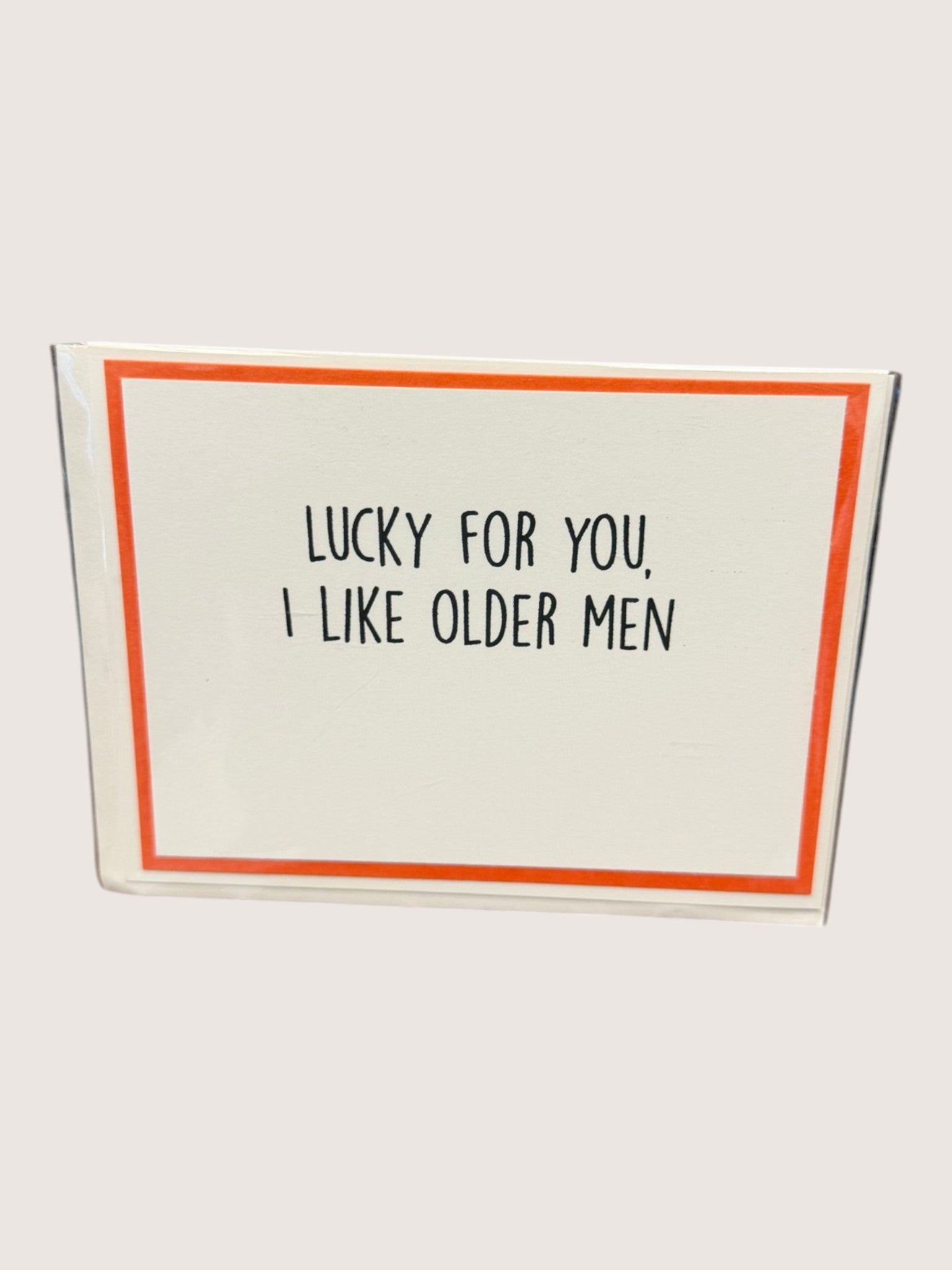 Card with text 'Lucky for you, I like older men' on a white background