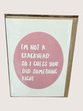 Card with pink circle and text on a light background