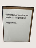 Birthday card with humorous text on a plain background