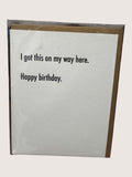 Birthday card with humorous text on a plain background