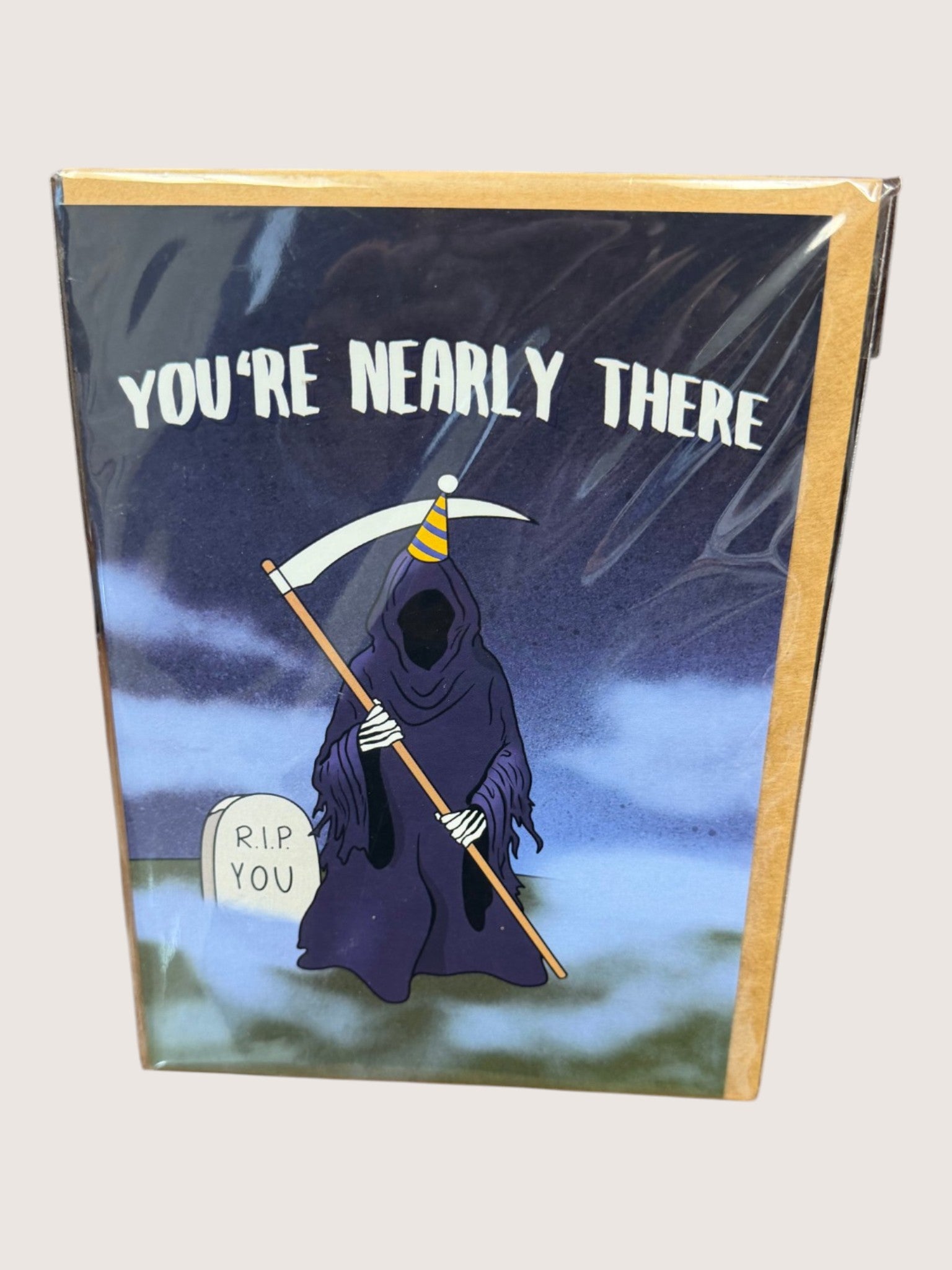 Card with a cartoon grim reaper holding a scythe and text 'You're Nearly There' on a dark background.