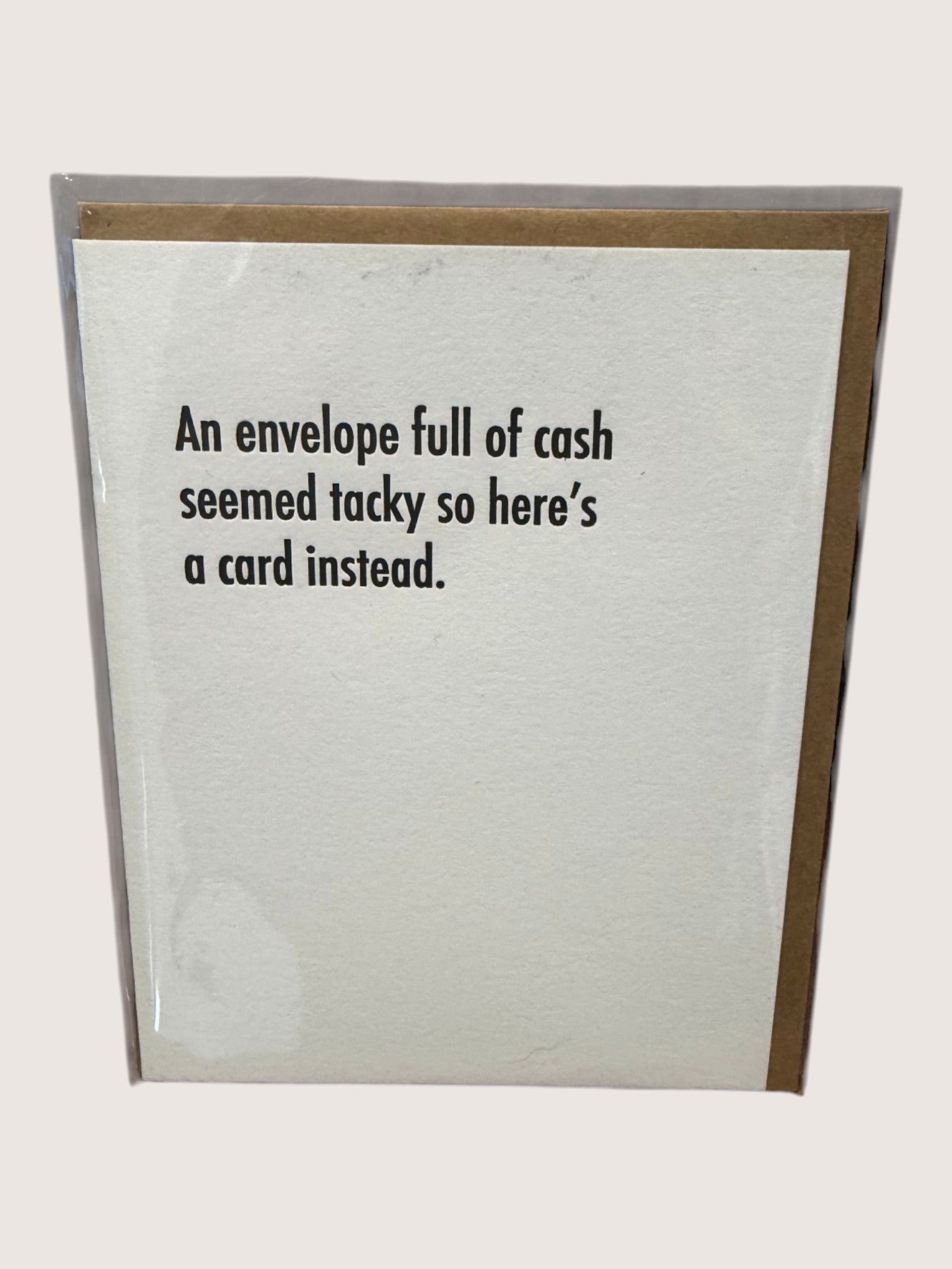 Card with text 'An envelope full of cash seemed tacky so here's a card instead.' on a white background