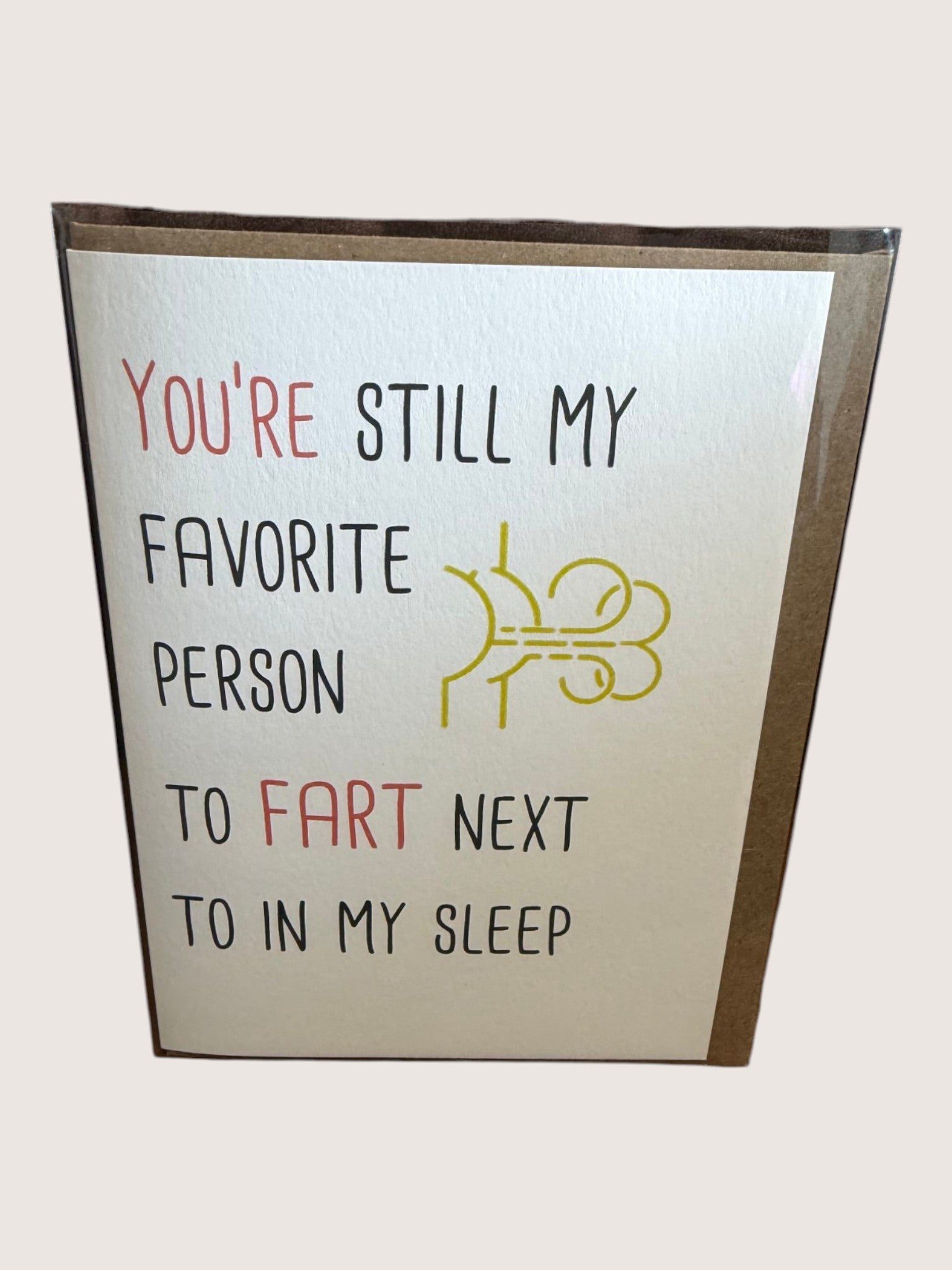 Card with humorous text and a graphic of a frowny face on a white background