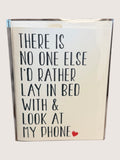 Card with text 'There is no one else I'd rather lay in bed with & look at my phone' on a light background