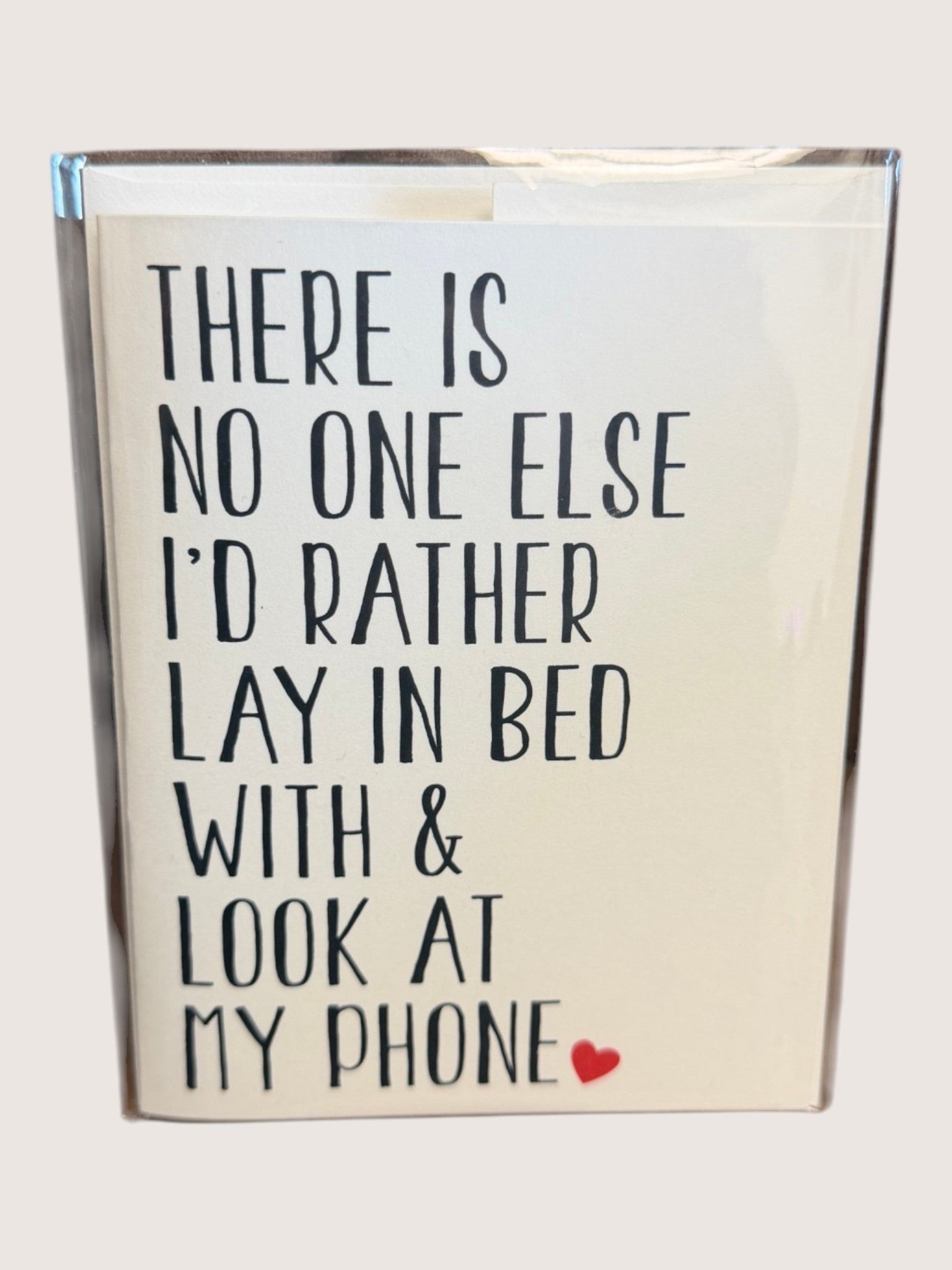 Card with text 'There is no one else I'd rather lay in bed with & look at my phone' on a light background