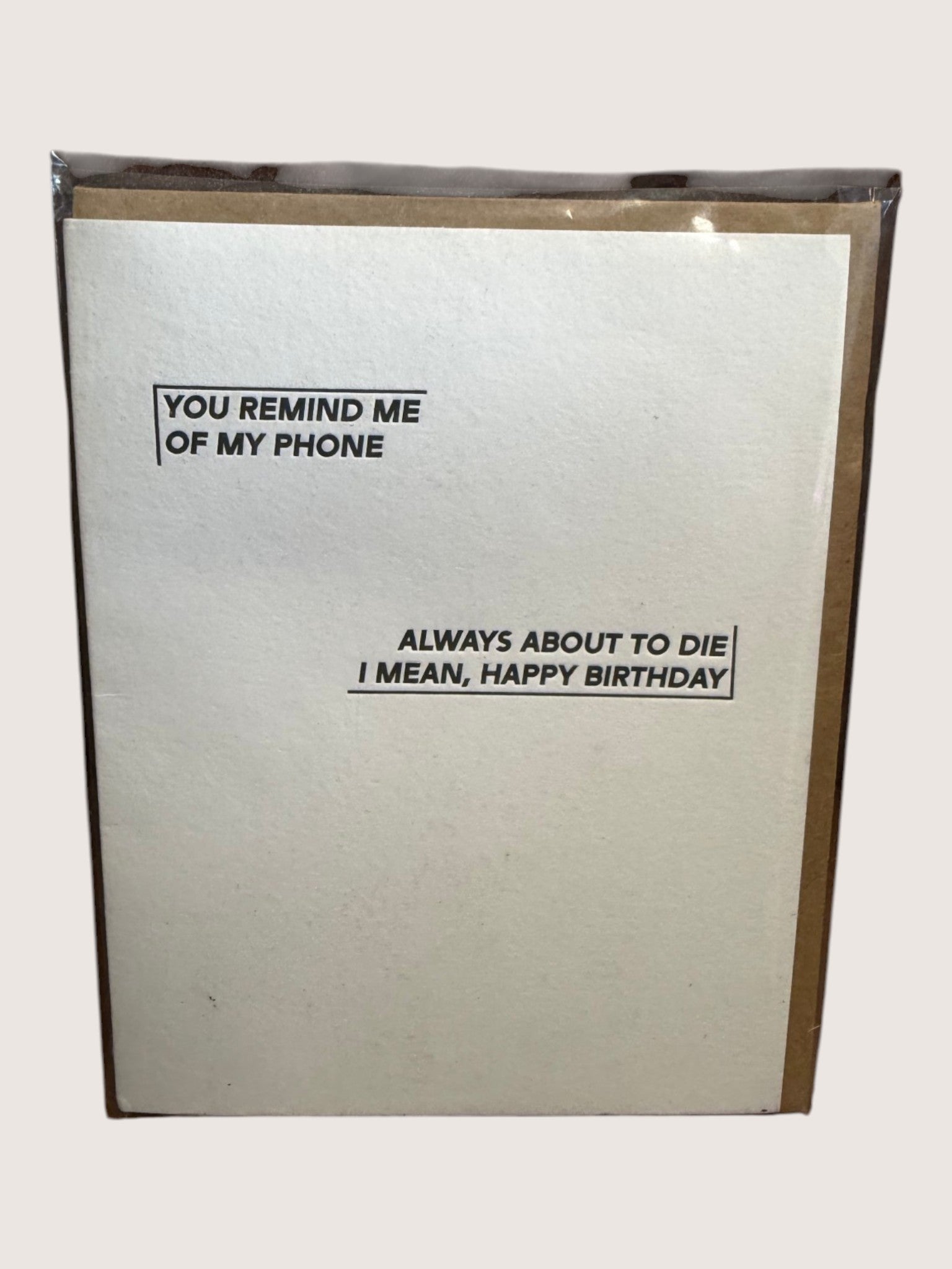 Card with humorous birthday message on a plain background
