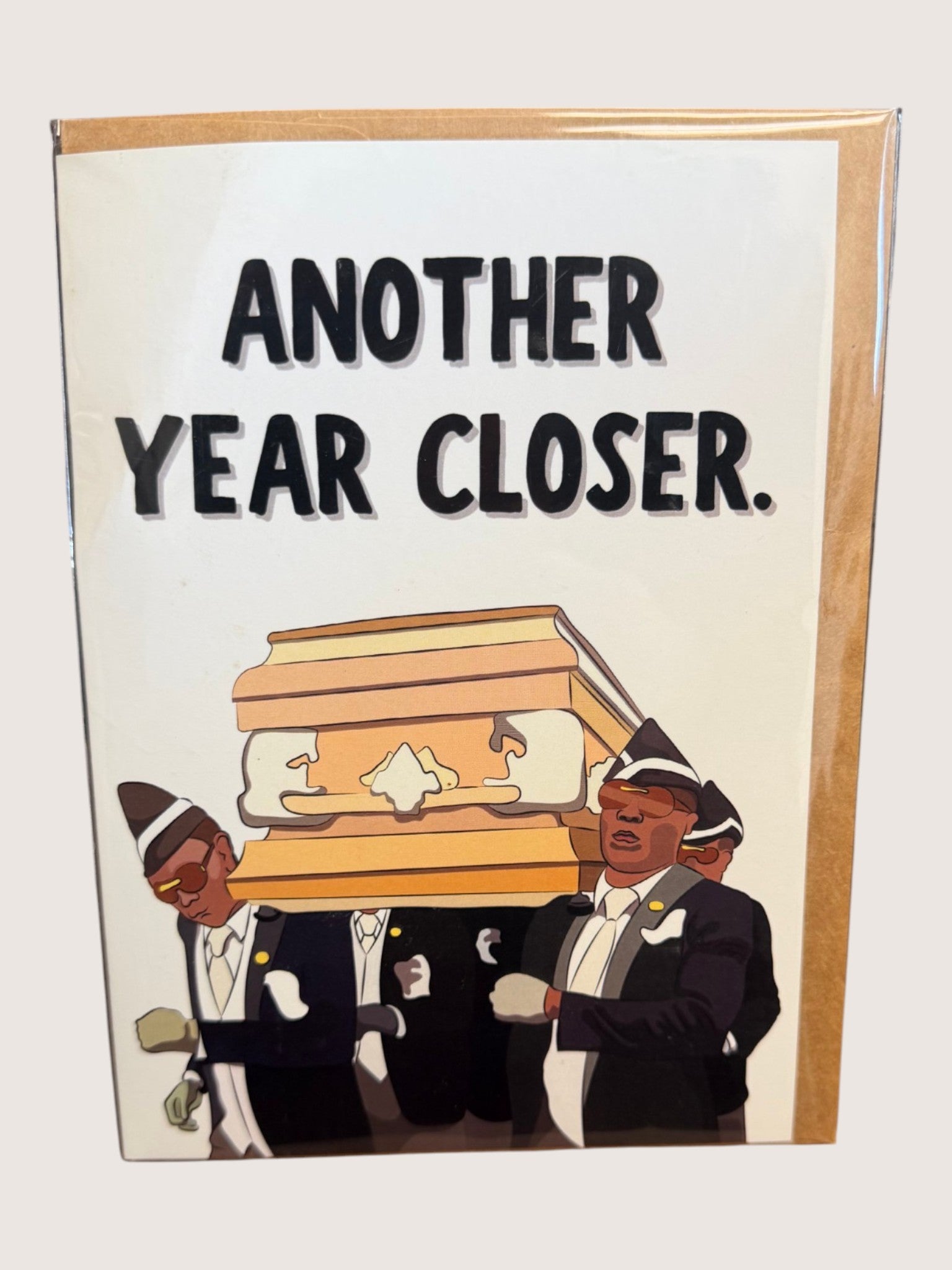 Greeting card with text 'another year closer.' and a humorous meme