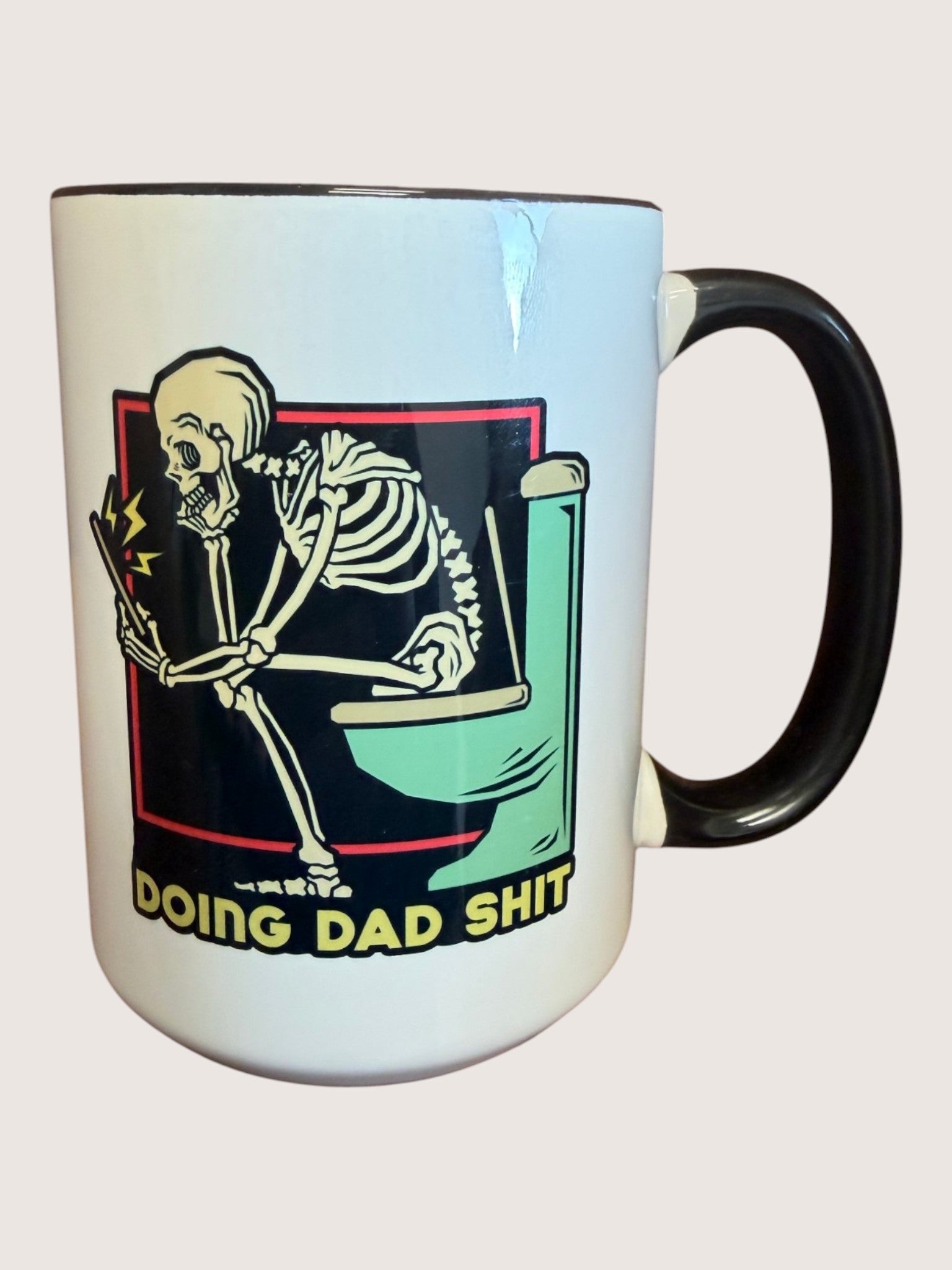 Mug with skeleton design and text on a white background