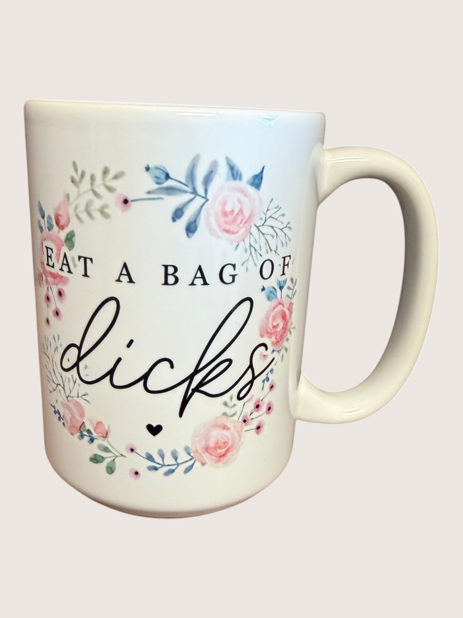 Mug with floral design and text on a white background