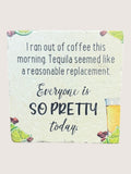 coaster with humorous text about coffee and tequila, featuring a lime and tequila bottle illustration.