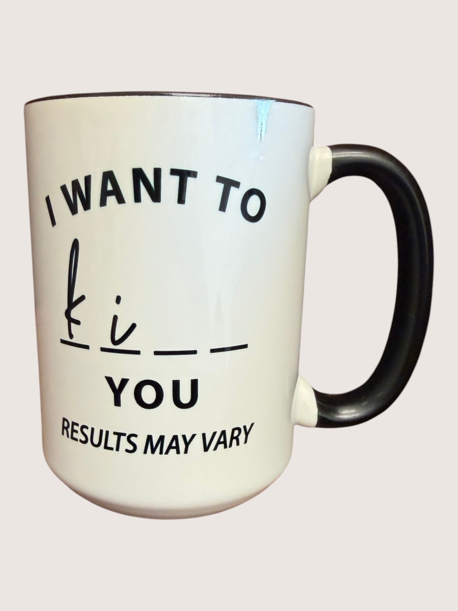 White mug with black text on a white background