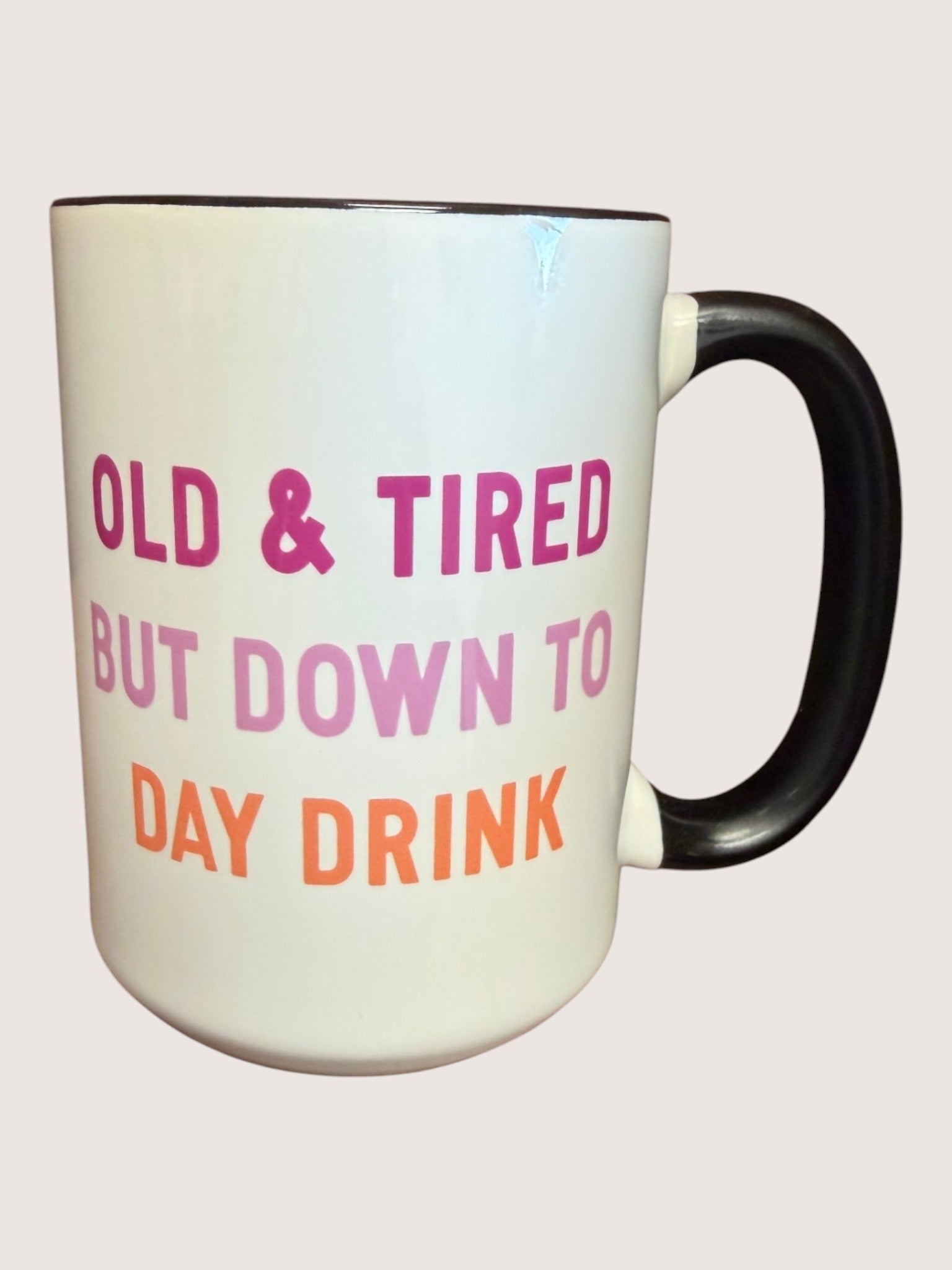 Mug with text 'Old & Tired But Down To Day Drink' on a light background