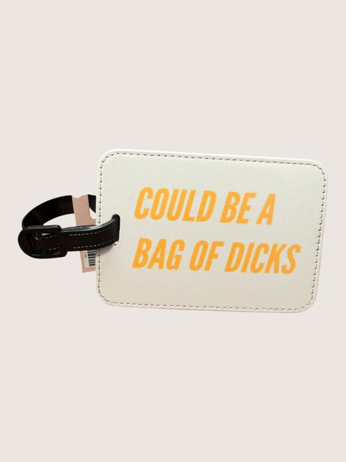 Luggage tag with text 'COULD BE A BAG OF DICKS' on a beige background