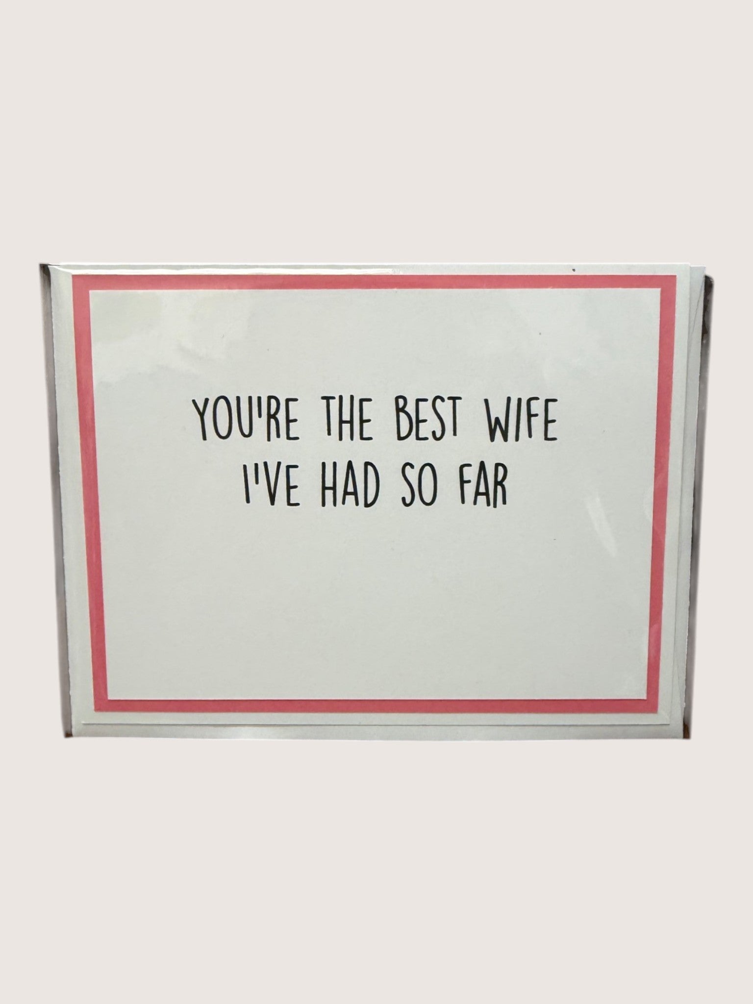 Card with text 'You're the best wife I've had so far' on a white background