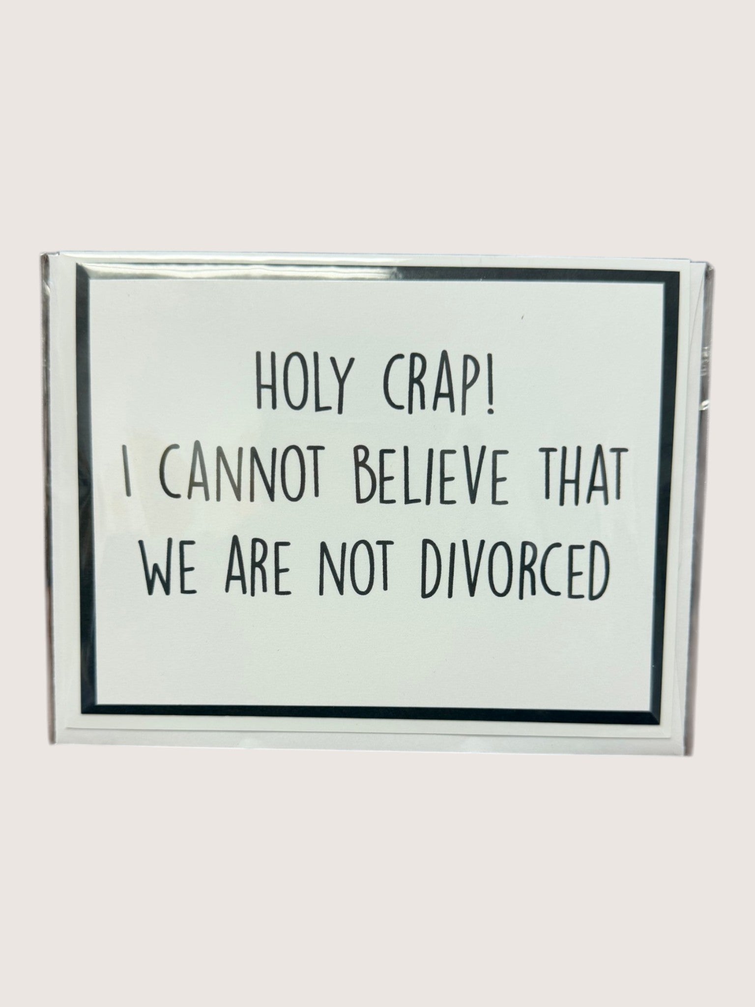 Glass card with humorous text on a white background