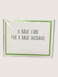 Card with text 'A basic card for a basic husband' on a white background