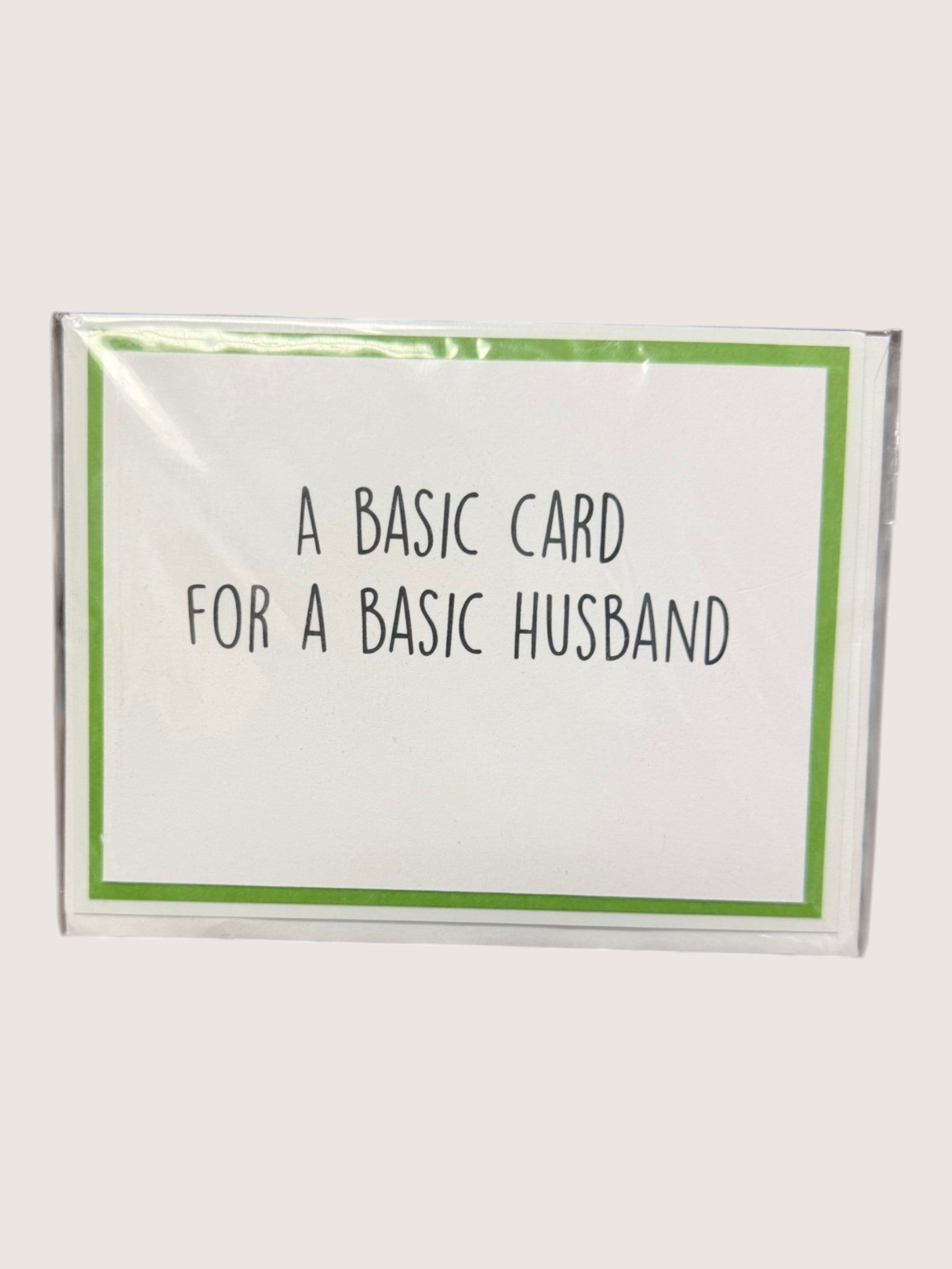 Card with text 'A basic card for a basic husband' on a white background