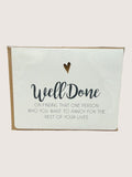 Card with 'Well Done' text and heart symbol on a white background