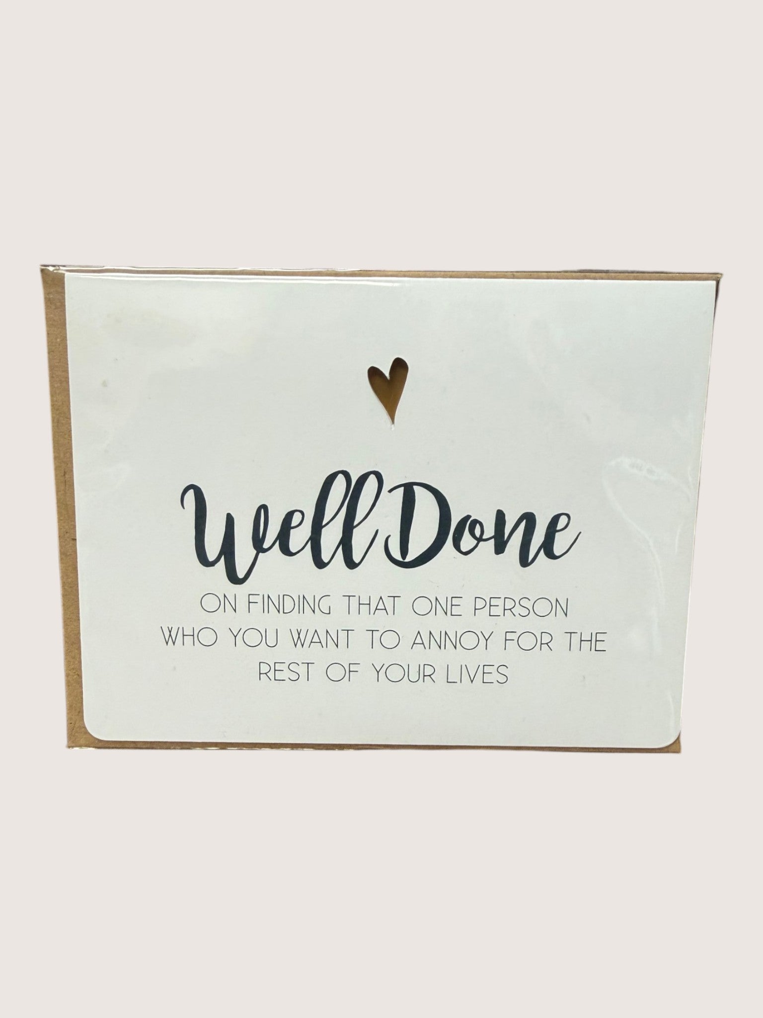 Card with 'Well Done' text and heart symbol on a white background