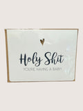Card with text 'Holy Shit, you're having a baby!' on a white background