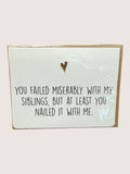 Card with humorous text and heart symbol on a light background