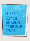 Blue card with text 'I LIKE YOU BECAUSE WE HATE ALL OF THE SAME PEOPLE.' on a light gray background