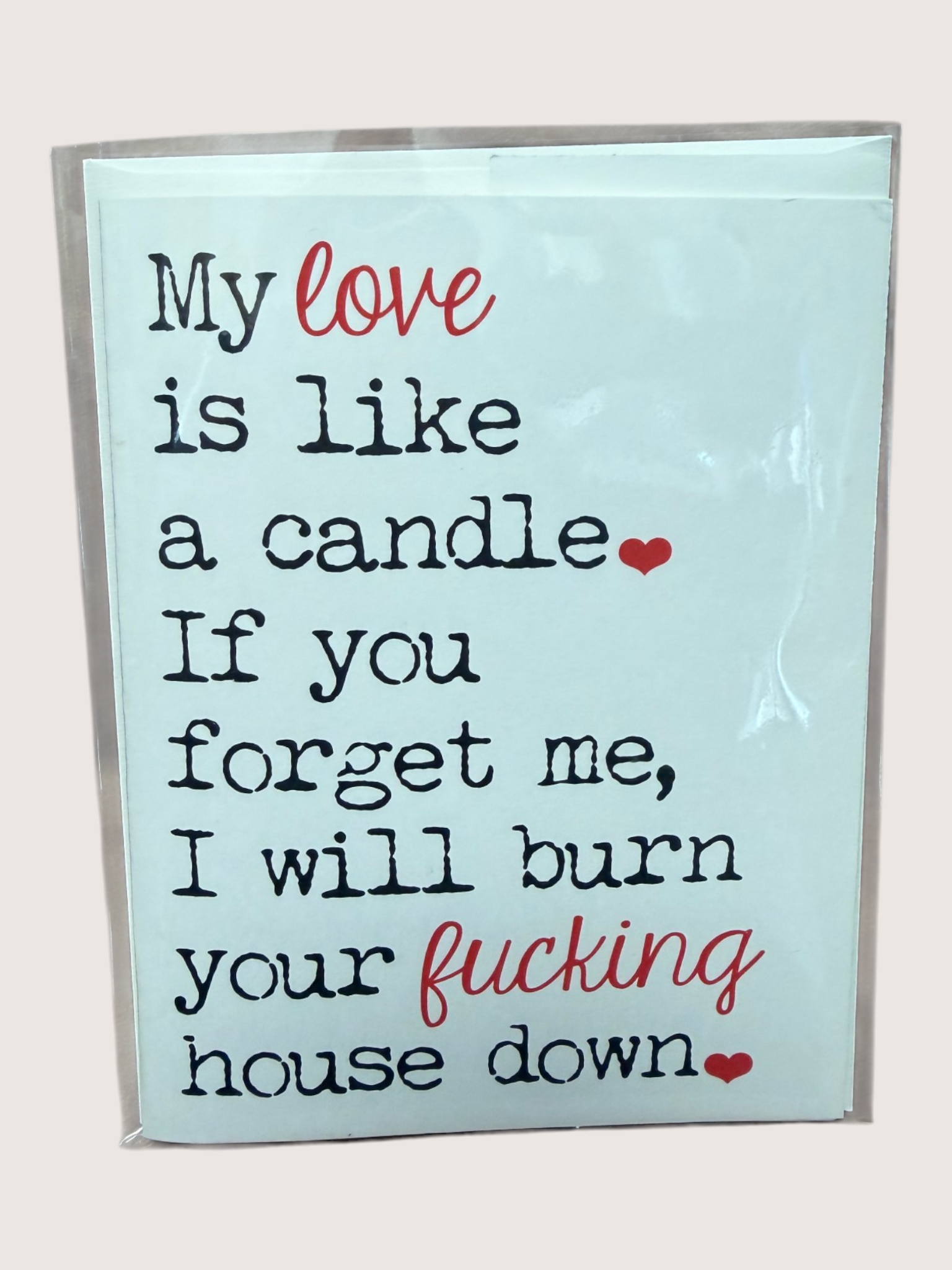 Card with humorous text about love and a candle on a light blue background
