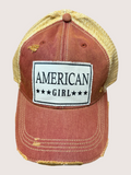Red distressed cap with 'American Girl' patch on a light gray background