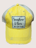 Yellow cap with 'Sunshine & Beer, That's Why I'm Here' patch on a light pink background