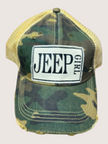 Camouflage cap with 'Jeep Girl' patch on a beige background