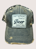 Vintage-style cap with a patch reading 'Ain't nothing that a beer can't fix' on a light gray background