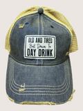 Denim cap with yellow mesh back and text patch on a light gray background